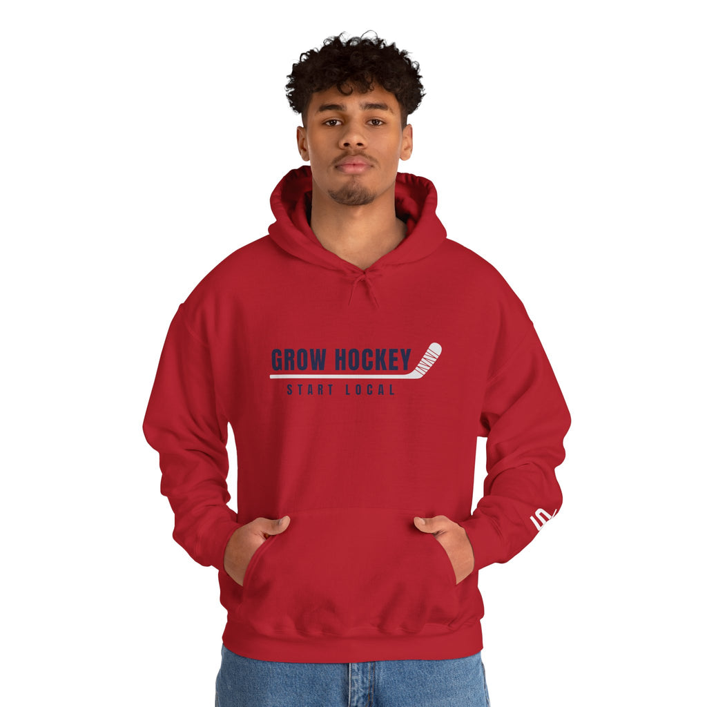 Male model wearing Grow Hockey Start Local hoodie with bold front graphic and taped hockey stick design.