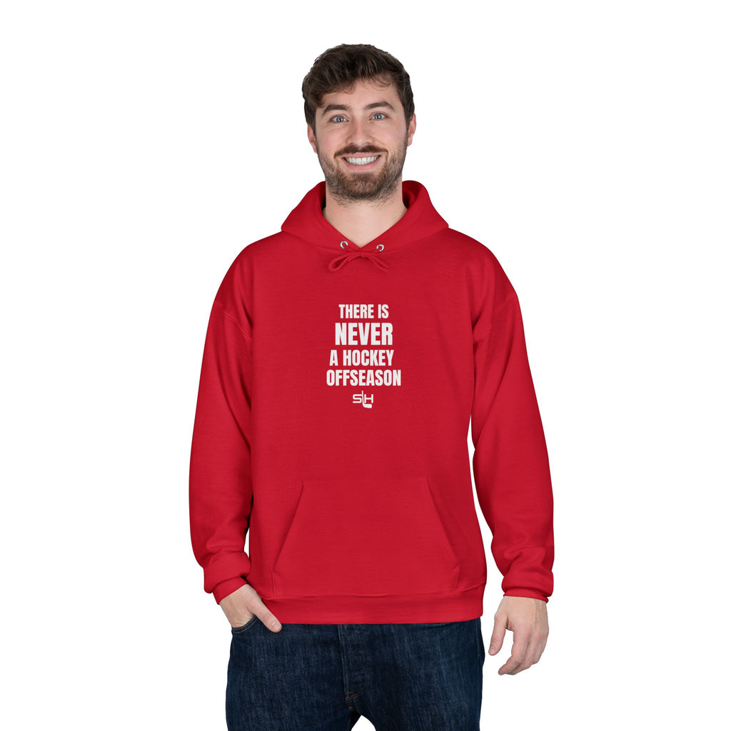 Male hockey fan wearing navy ‘Never a Hockey Offseason’ hoodie by Slash Hockey, casual rinkside style.