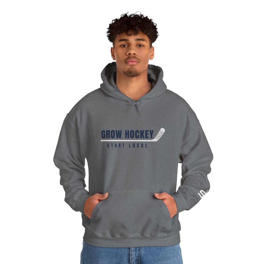 Male model wearing Grow Hockey Start Local hoodie with bold front graphic and taped hockey stick design.