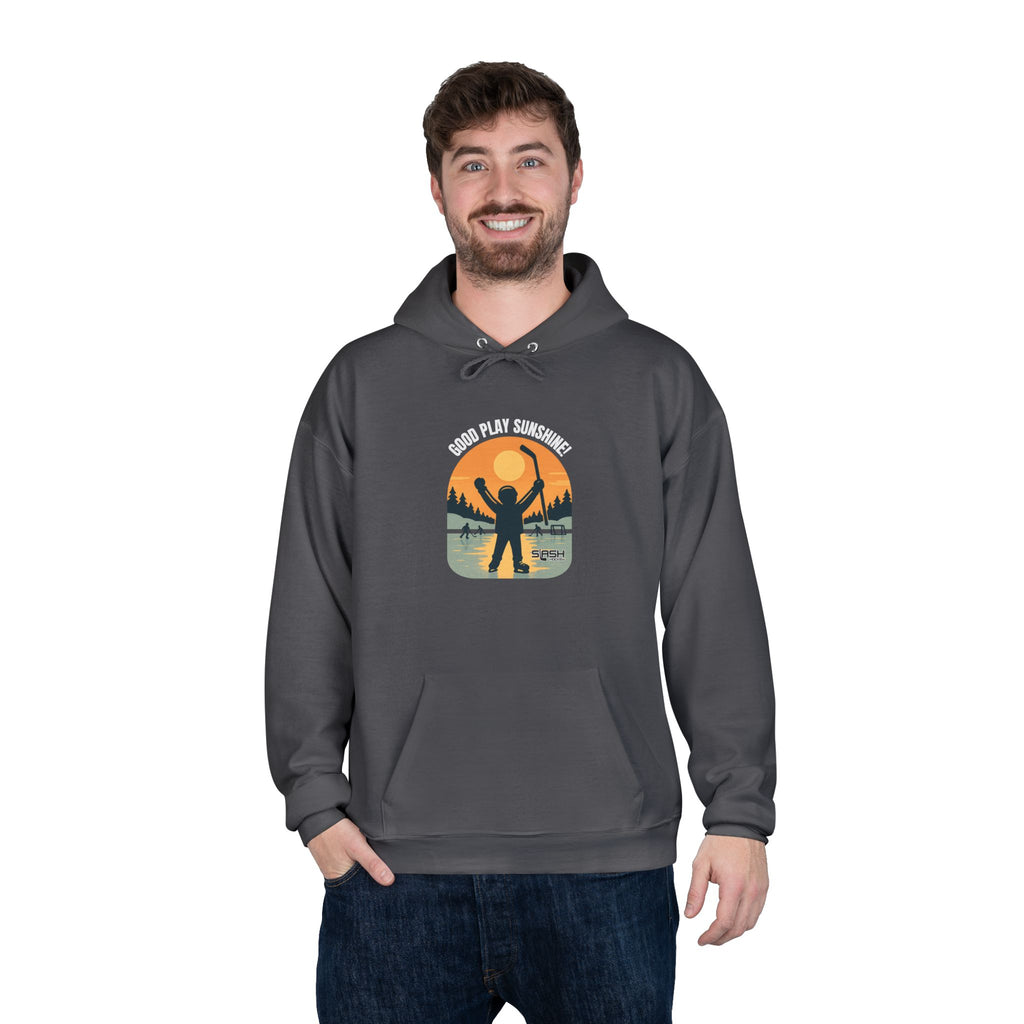 Male model wearing the Good Play Sunshine! Hoodie outdoors on a winter day, showing the nostalgic hockey graphic and comfortable athletic fit.