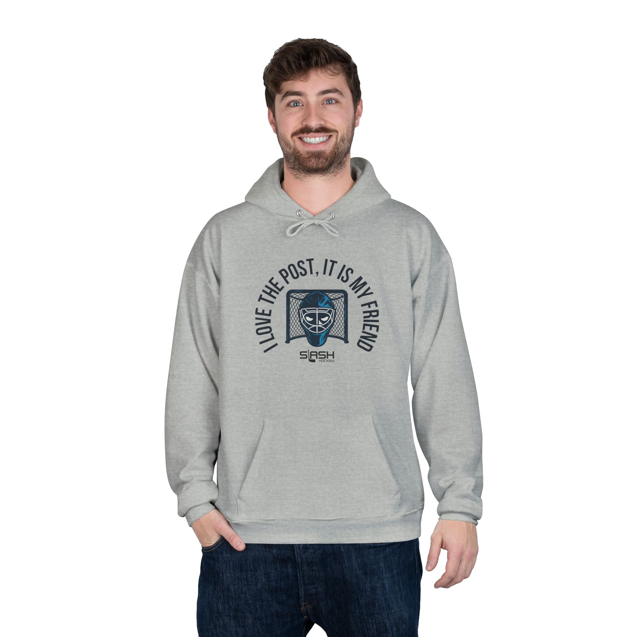 Male model wearing goalie hoodie with “I love the post, it is my friend” design, standing in casual hockey-inspired setting.