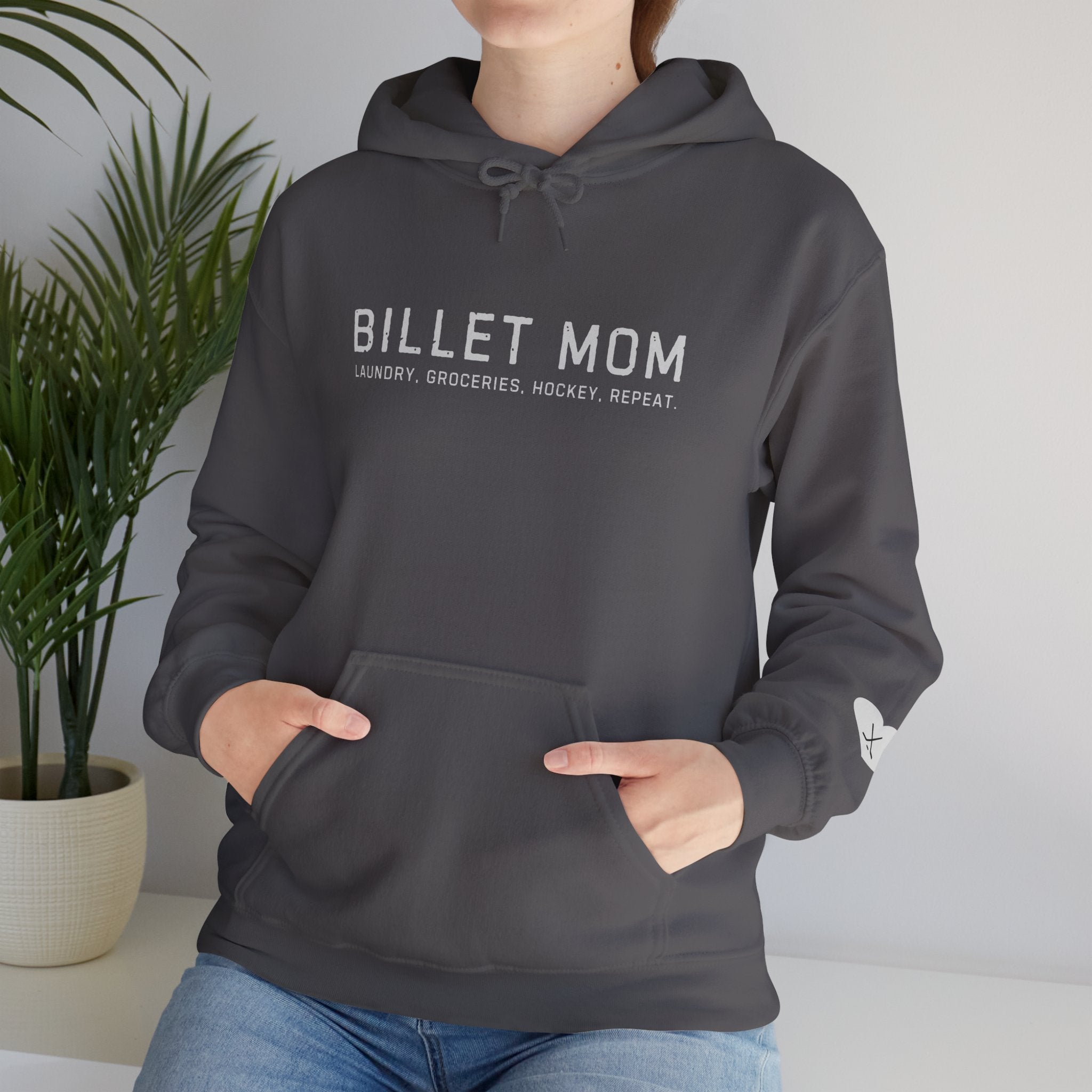 Woman wearing Billet Mom hoodie representing the life of a junior hockey billet mom supporting players and host families