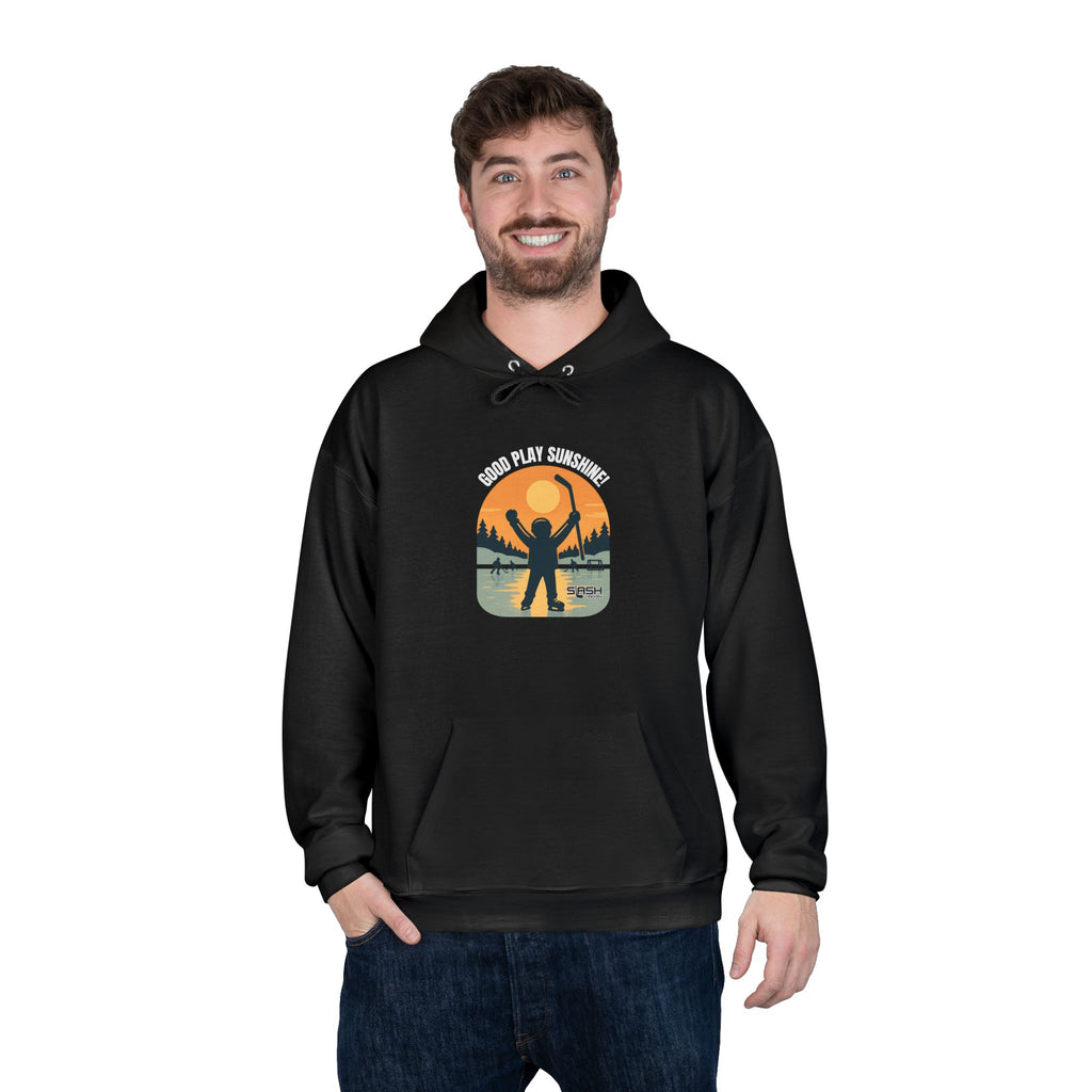 Male model wearing the Good Play Sunshine! Hoodie outdoors on a winter day, showing the nostalgic hockey graphic and comfortable athletic fit.