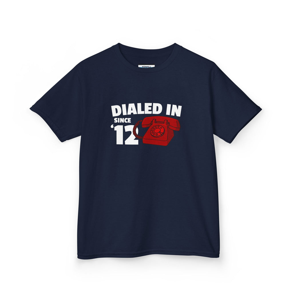 Youth Dialed In Since ’12 Tee, front view — youth hockey t-shirt featuring a bold “Dialed In Since ’12” graphic on the chest, clean athletic fit, displayed on a plain background.