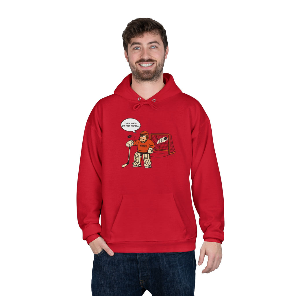 “Mad Goalie Hockey Hoodie lifestyle photo — model wearing hockey culture hoodie with angry goalie design, casual fit for rink, travel, or everyday wear.”