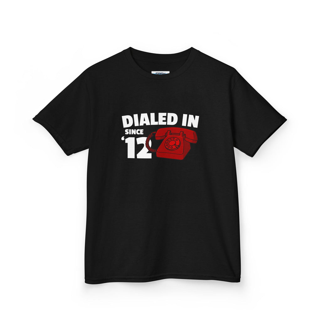 Youth Dialed In Since ’12 Tee, front view — youth hockey t-shirt featuring a bold “Dialed In Since ’12” graphic on the chest, clean athletic fit, displayed on a plain background.