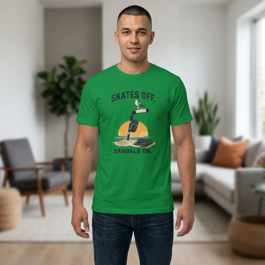 Male model wearing the Skates Off. Sandals On. hockey t-shirt featuring a beach-inspired graphic with a hockey stick in the sand, hanging glove, seagull, flip-flops, and sunset. The relaxed summer hockey design is displayed prominently on the front of the shirt.