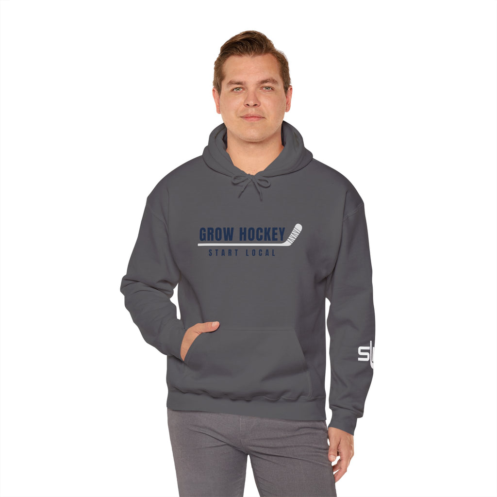 Male model wearing Grow Hockey Start Local hoodie with bold front graphic and taped hockey stick design.
