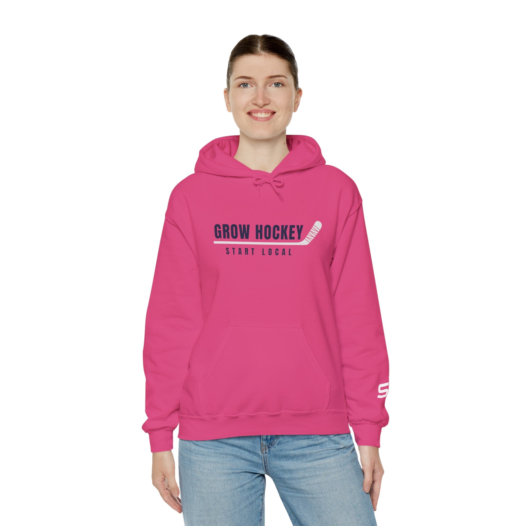 Female model wearing Grow Hockey Start Local hoodie featuring bold hockey typography and taped stick graphic.