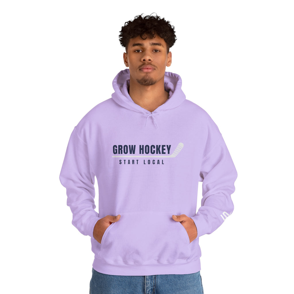 Male model wearing Grow Hockey Start Local hoodie with bold front graphic and taped hockey stick design.