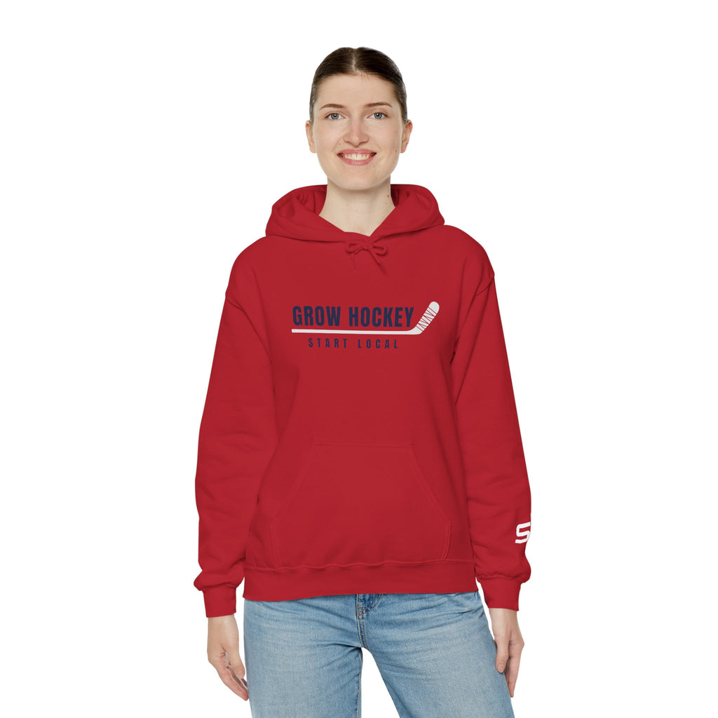 Female model wearing Grow Hockey Start Local hoodie featuring bold hockey typography and taped stick graphic.