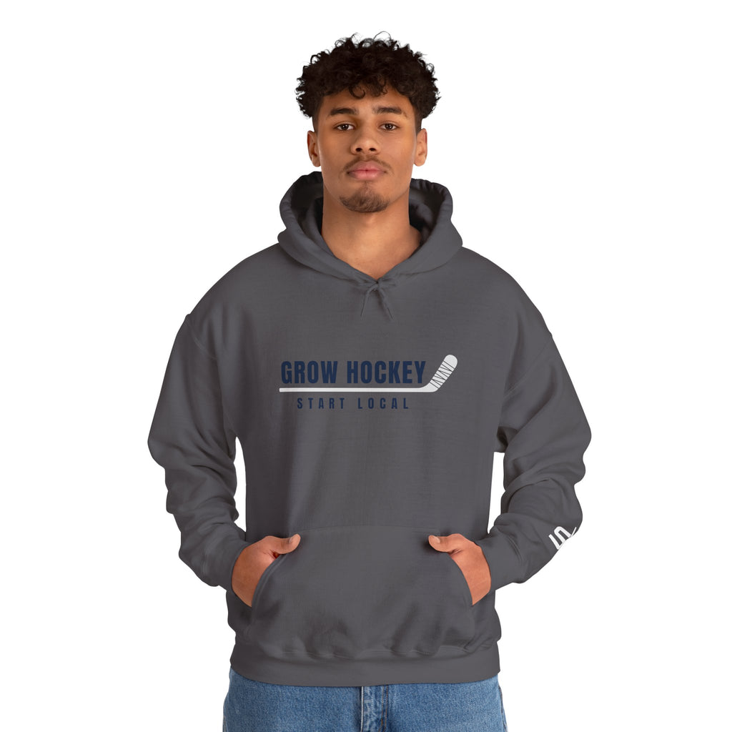 Male model wearing Grow Hockey Start Local hoodie with bold front graphic and taped hockey stick design.