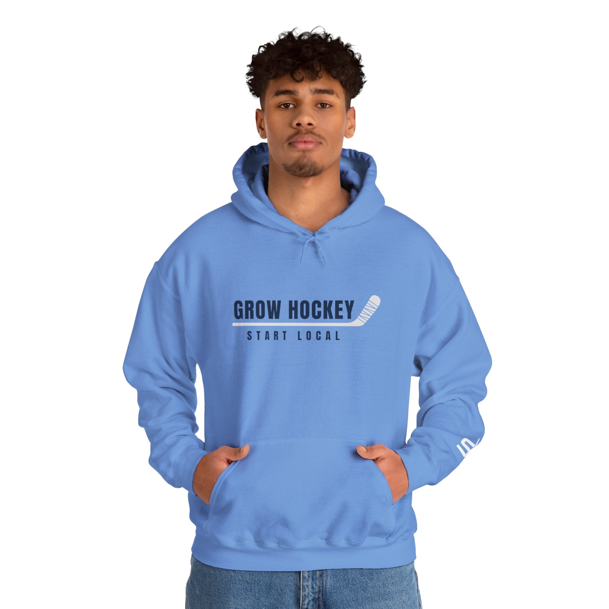 Male model wearing Grow Hockey Start Local hoodie with bold front graphic and taped hockey stick design.