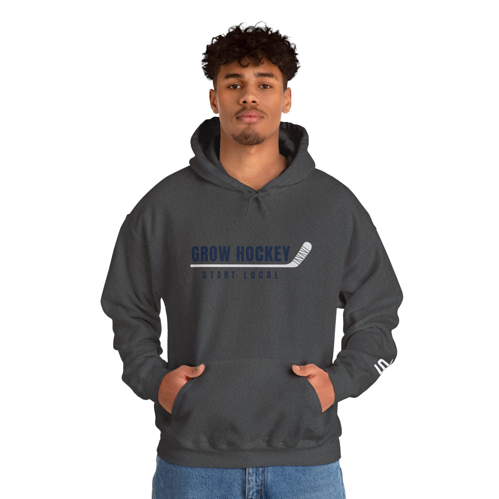Male model wearing Grow Hockey Start Local hoodie with bold front graphic and taped hockey stick design.