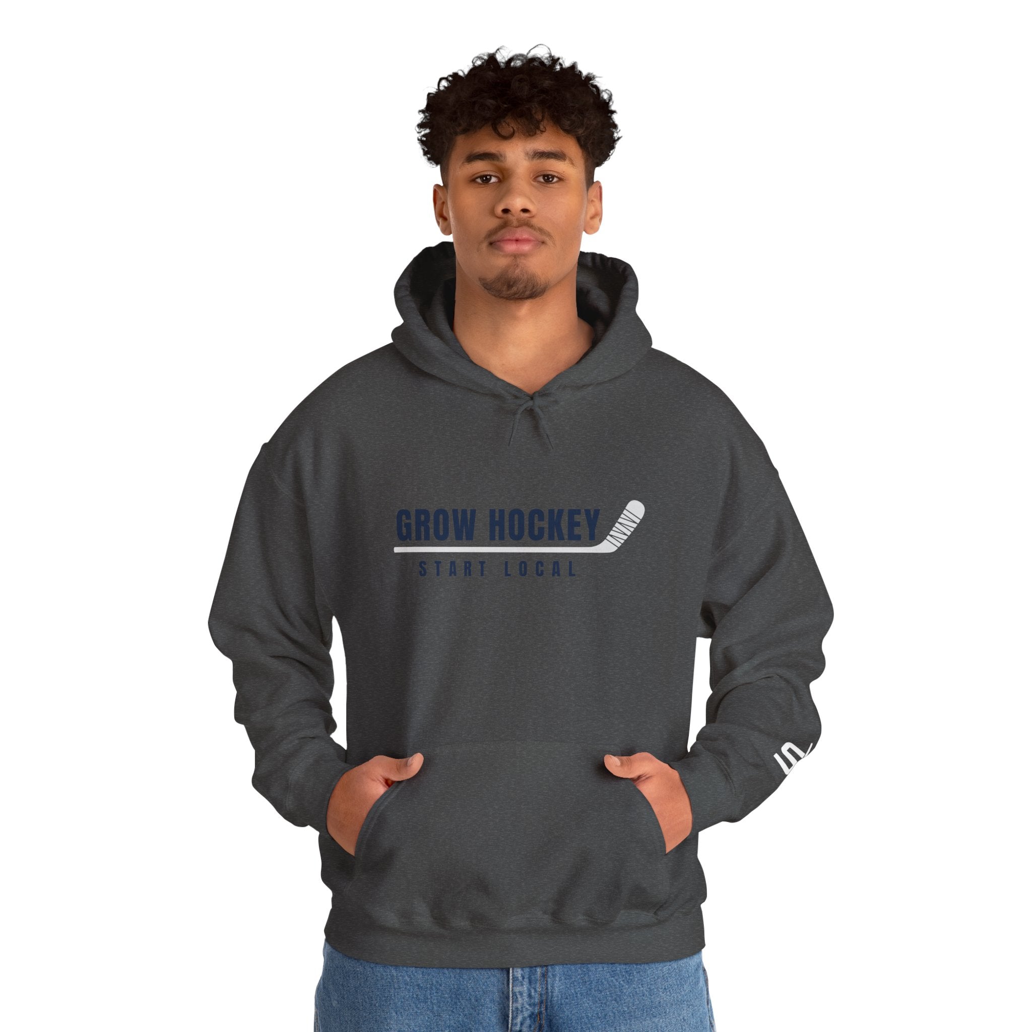 Male model wearing Grow Hockey Start Local hoodie with bold front graphic and taped hockey stick design.